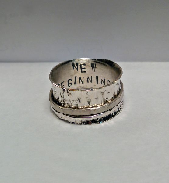 Silver spinner ring made by a student