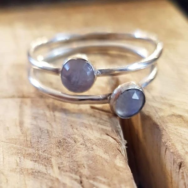 silver stacking rings with gems made by a student