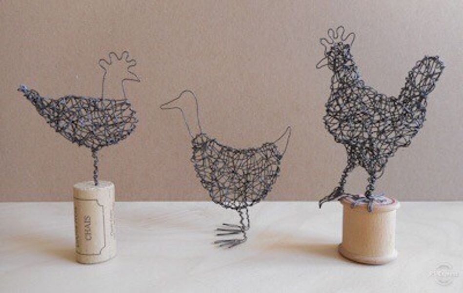 Birds on corks and cotton reels.