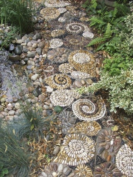 David James of Olicana Mosaics -shell pavement consisting of repeating forms around a pond.  Ilkley
