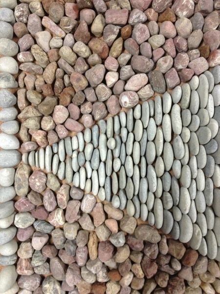 David James of  Olicana Mosaics - geometric pebble mosaic triangle Ilkley