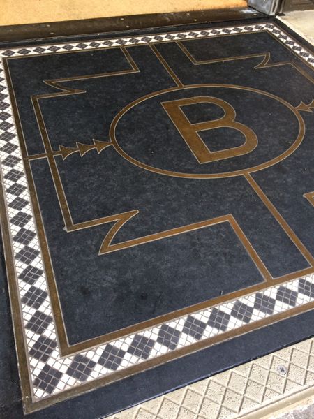 Bettys York entrance with bronze and mosaic inlay