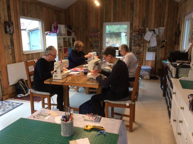 Ladies hard at work on our beginner's quilting course