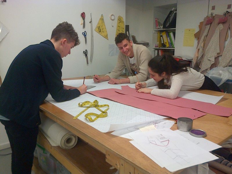 Three of my lovely students pattern cutting.