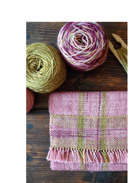A handwoven pink scarf with hand dyed yarns that are used in the Scarf and a shuttle