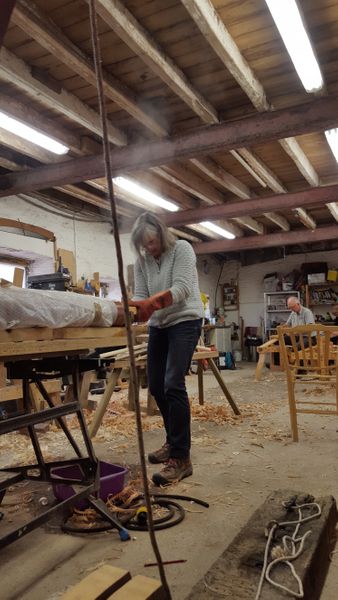 Retrieving steamed timber from a steam chamber