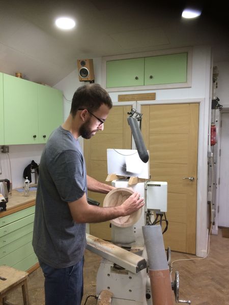 Student turning a bowl