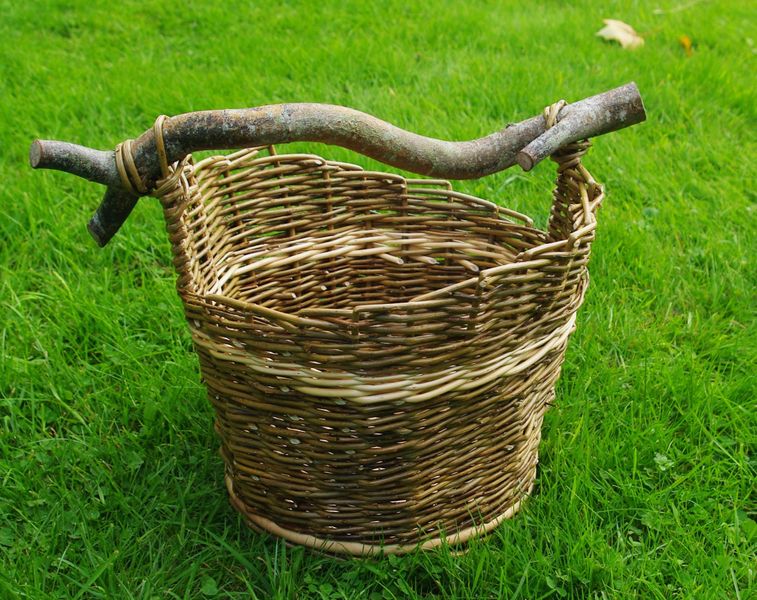 Jane's white and brown willow basket with contorted willow handle.
