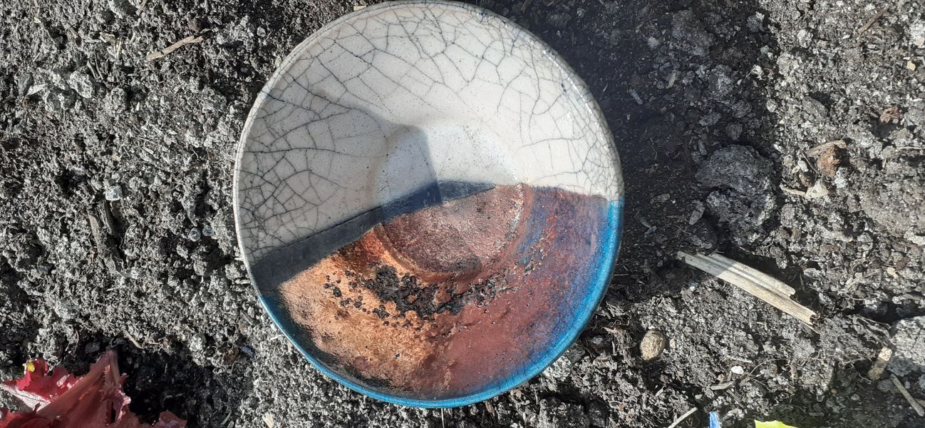 Raku bowl with crackle and reduced copper glaze
