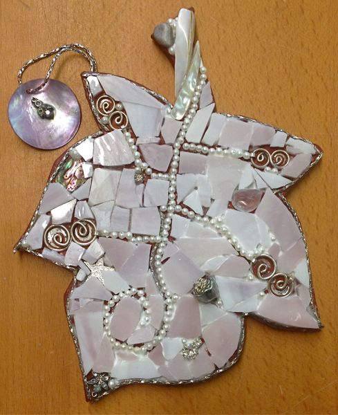 Students work - made using stained glass, pearls, silver jewellery and shells.