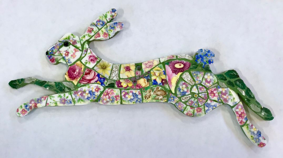 Mixed media mosaic made using vintage china, beads and porcelain flowers.