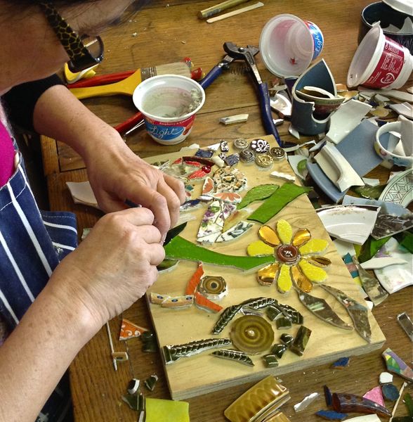 Students work - using a mix of stained glass and china.