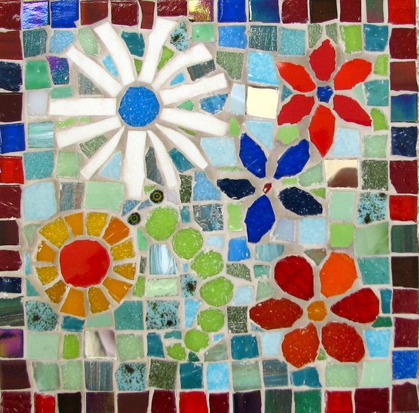 Students work - made using vitreous glass tiles, mirror tile and stained glass.