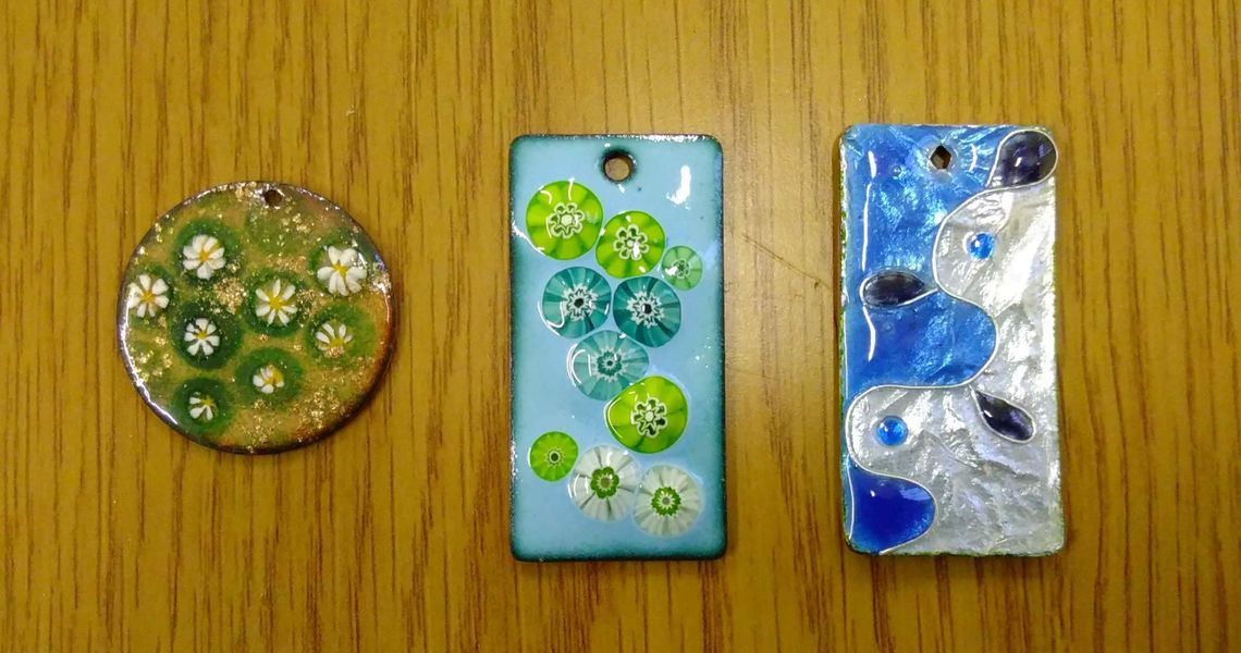 Enamelled glass pendants