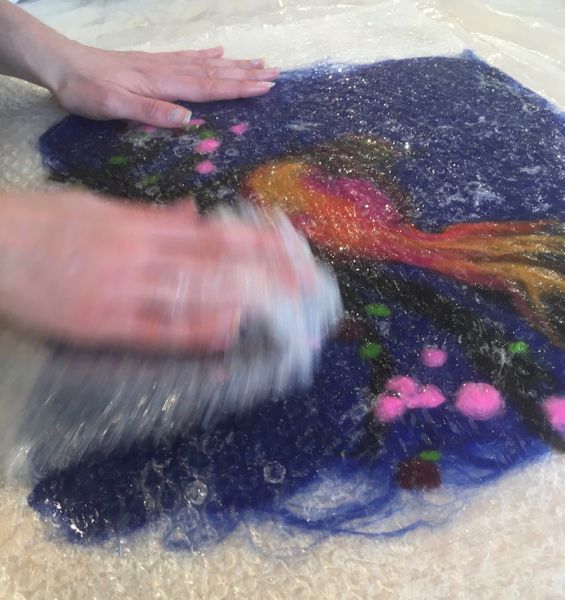 Emma C. wetting out & rubbing the wool image created