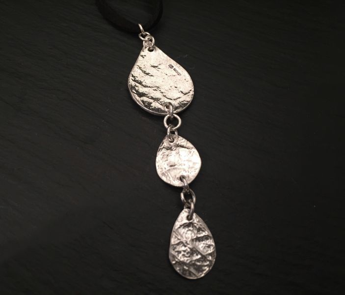 silver clay teardrops textured with leather