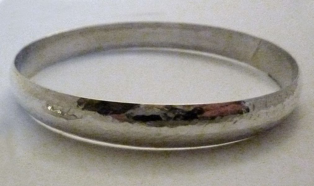 Silver hammered bangle by Claire Williams