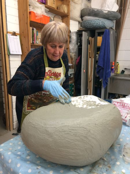 Pauline making the base for her pebble