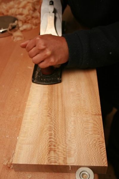 Shireen hand planing her Lacewood shelf