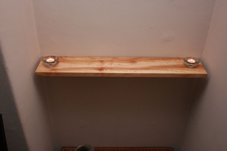 Floating shelf with tea lights in situ