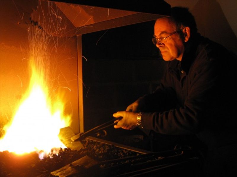 Master blacksmith Richard Bent demonstrating skills on a Red Anvil School of Blacksmithing course