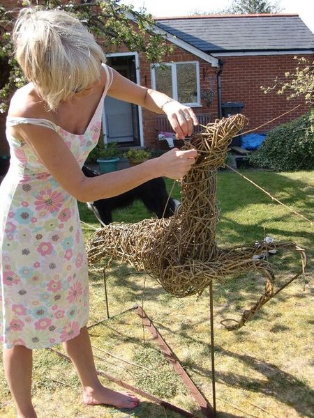 student working on her willow deer