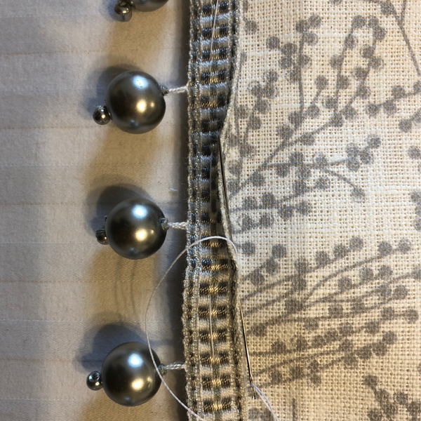 Cute hallway cushion in grey linen & silk combo with a beaded trim
