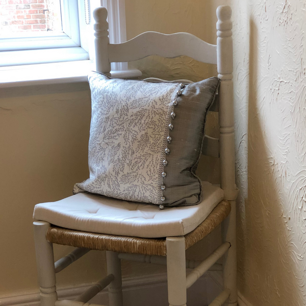 Cute hallway cushion in grey linen & silk combo with a beaded trim