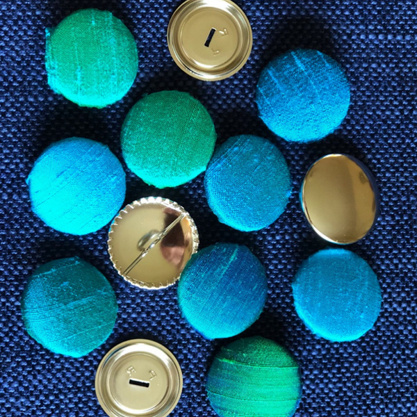 Bespoke handmade buttons in hues of blue and green to use with scatter cushions