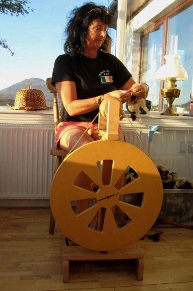 Bridie our spinning teacher spinning on our Dye to Hand-Spin week at Wild Rose Escapes