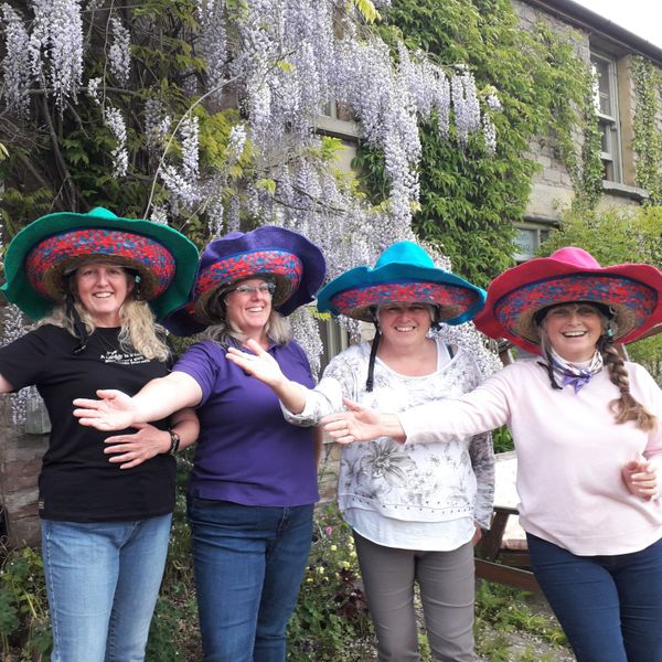 The Lovely Tory Dobbs and fellow Quadrillers in their Sombrarros fitting over their riding hats!