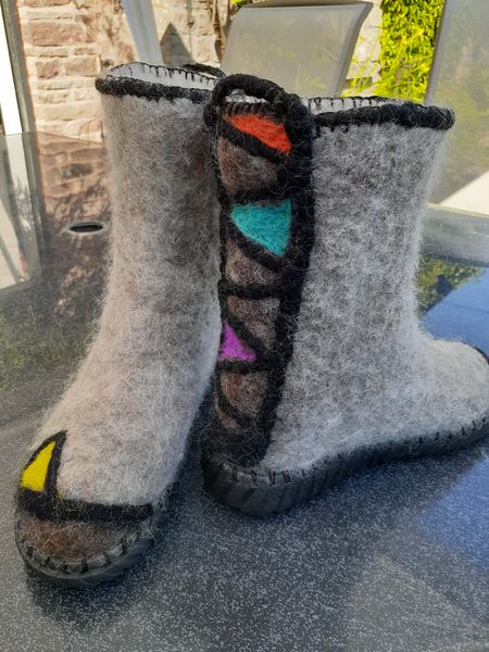 Felt boots with outdoor soles.