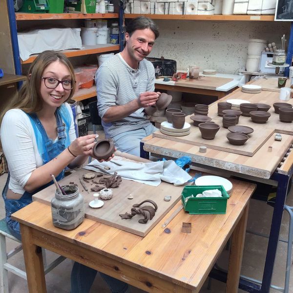 Day students finishing and decorating thrown pots from the mornings work.