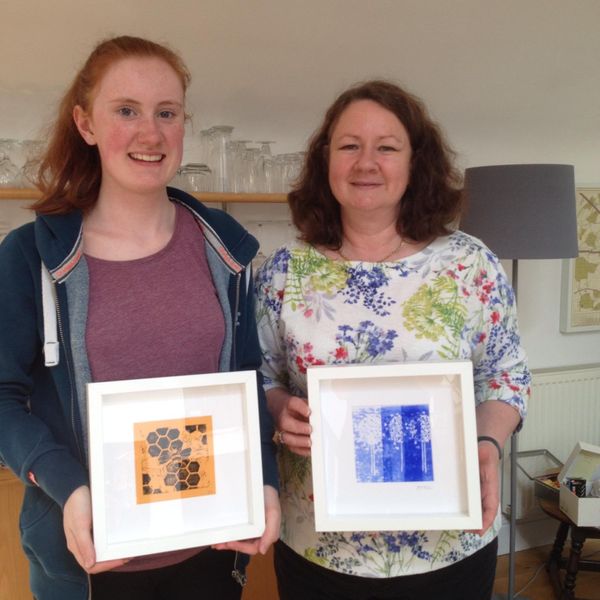 Printers with final framed pieces created on a beginners lino printing workshop in central Edinburgh