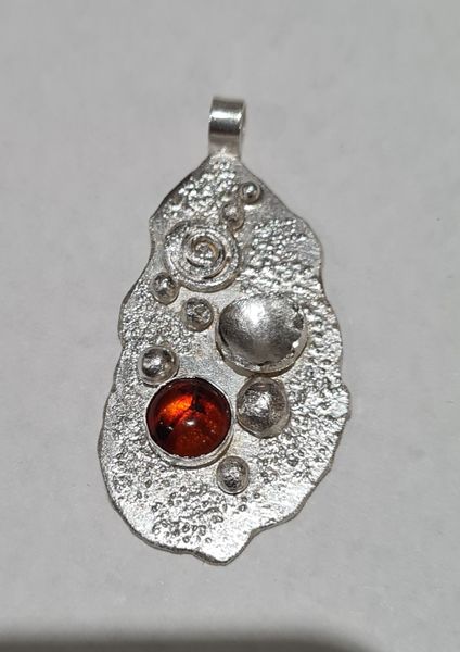 Amber pendant with granulation