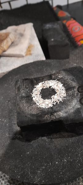 Melting silver to create a ring