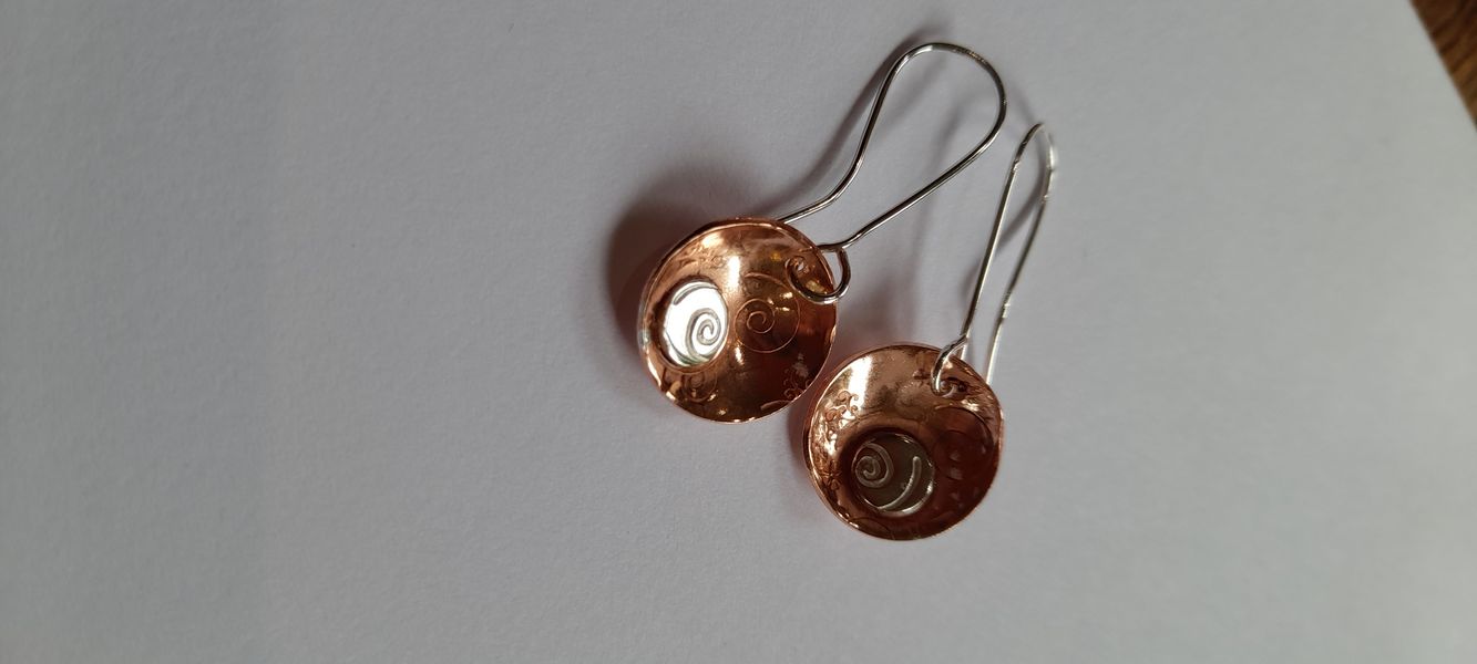 Copper and silver domed earrings.