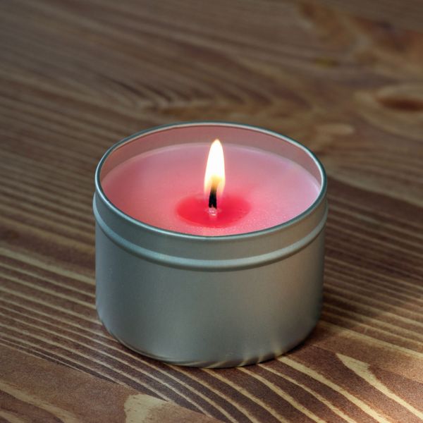 A candle in a tin