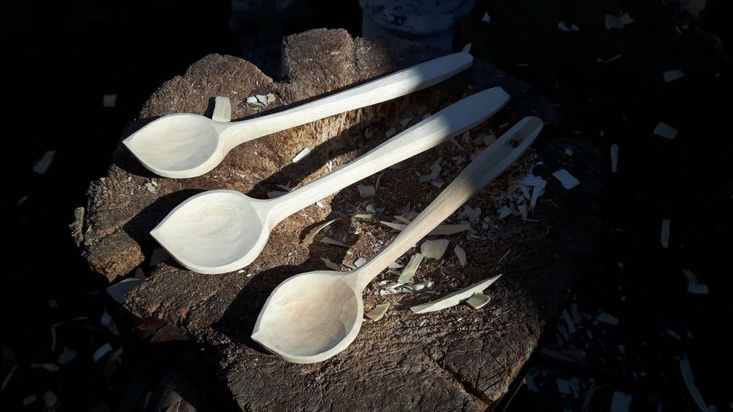 Freshly carved cooking spoons