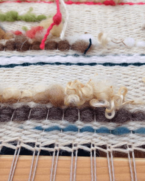 Students frame loom weaving