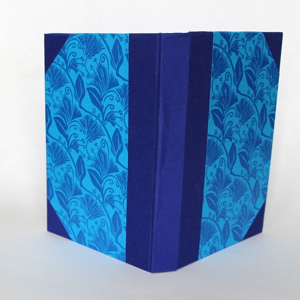 spine and corners are in matching blue book cloth