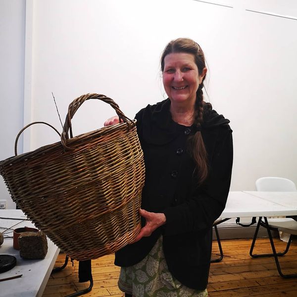 student with log basket