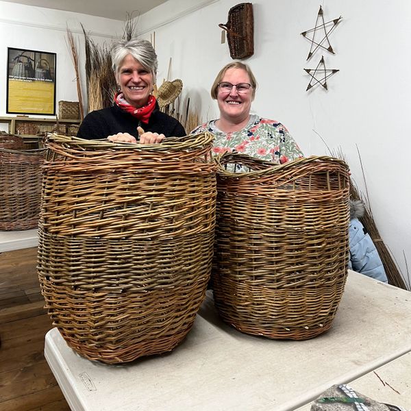 students with log baskets