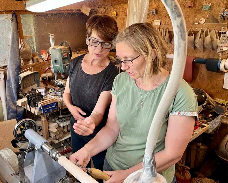 Liz Pearson teaching at the lathe.