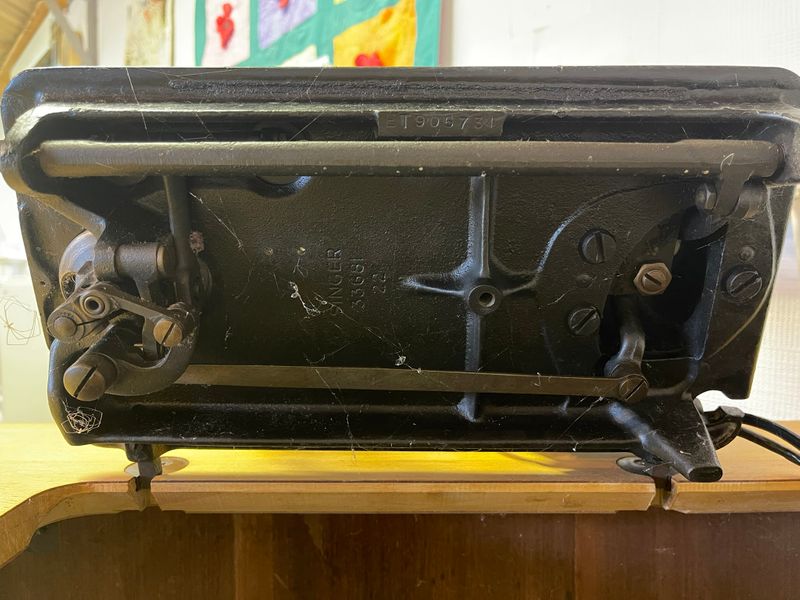 The underside of a vintage Singer sewing machine