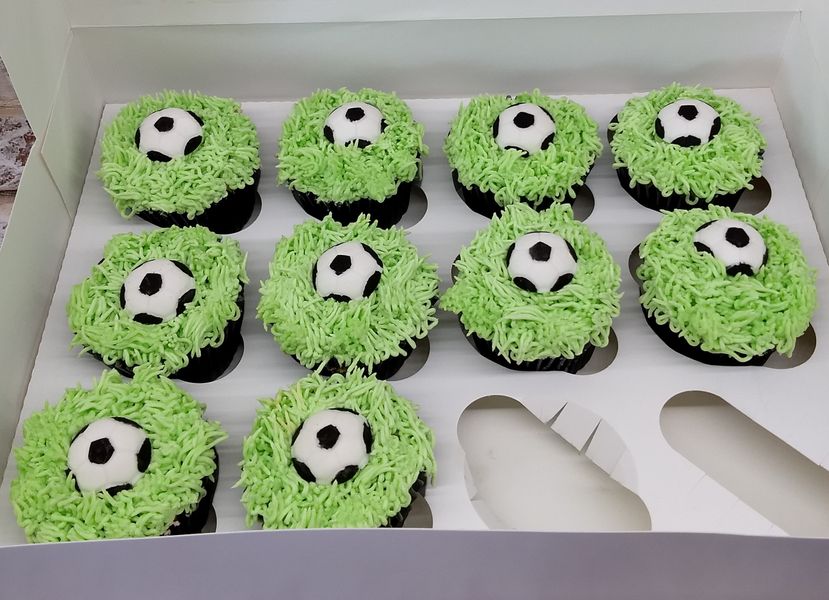 footballs on grass cupcakes