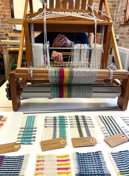 Student setting up the loom