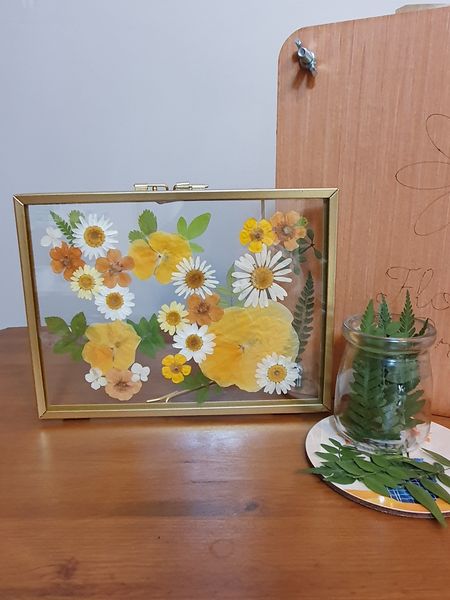 Pressed flowers in glass frame
