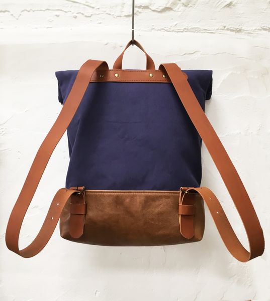 Navy canvas and tan leather rucksack back