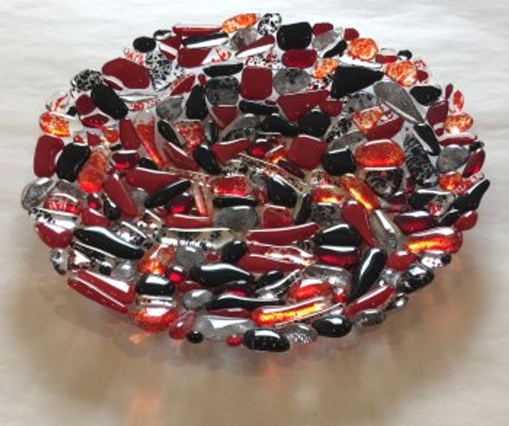 A beautiful fused glass pebble bowl made by student Tracey